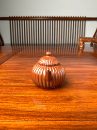 the front view of the handmade yixing teapot named shui ping