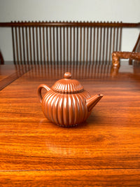 the left view of the handmade yixing teapot named shui ping