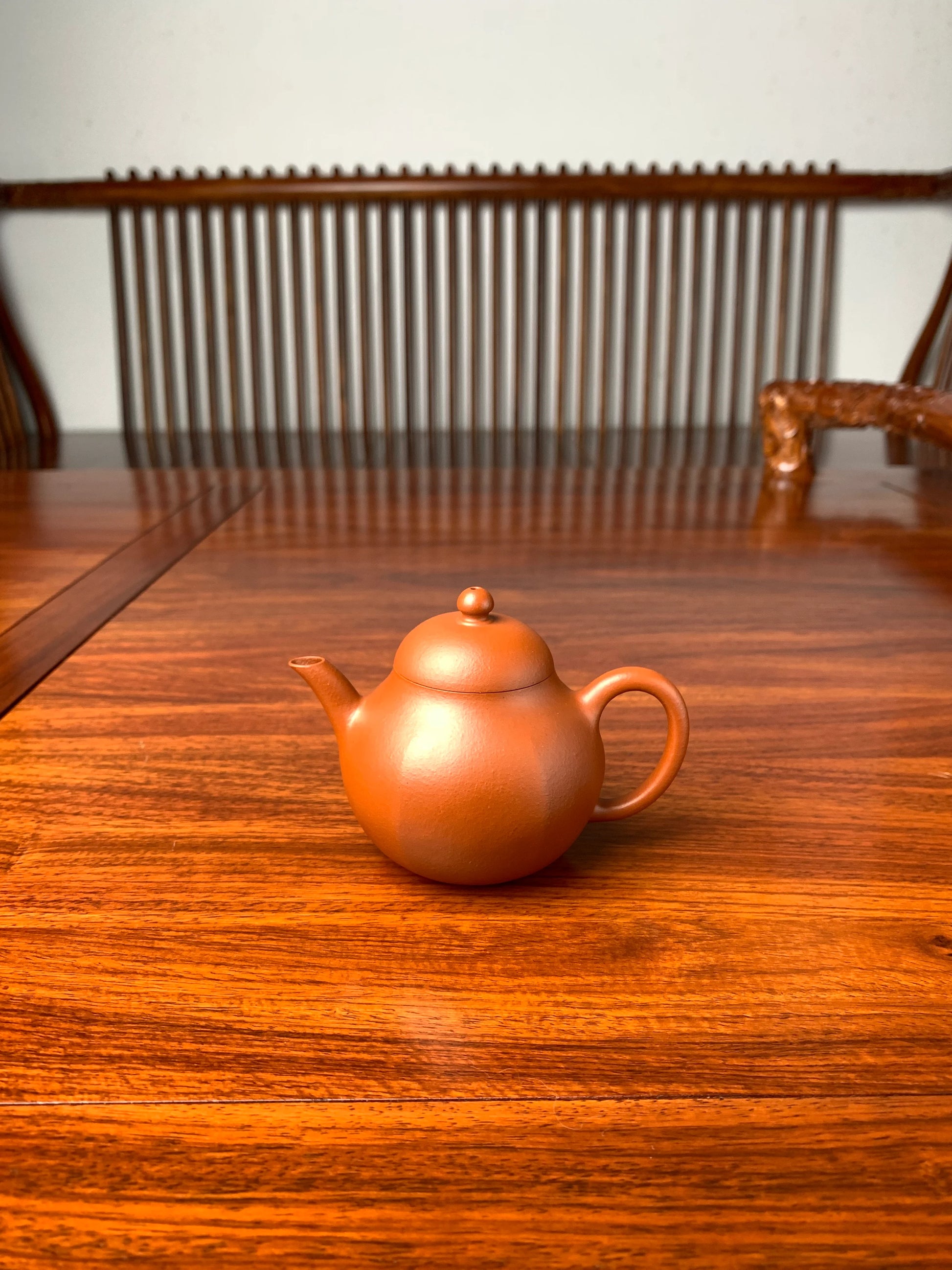 handmade yixing teapot named liu he on the table