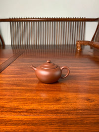 yixing teapot shapes yuan zhu on the table