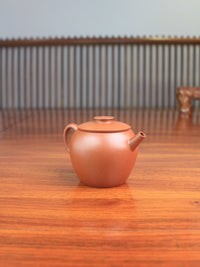 left view of the Yixing teapot Ju Lun handmade with Zisha clay