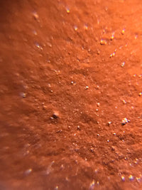  magnified view of the teapot surface shows high-quality zhuni clay as the raw material.