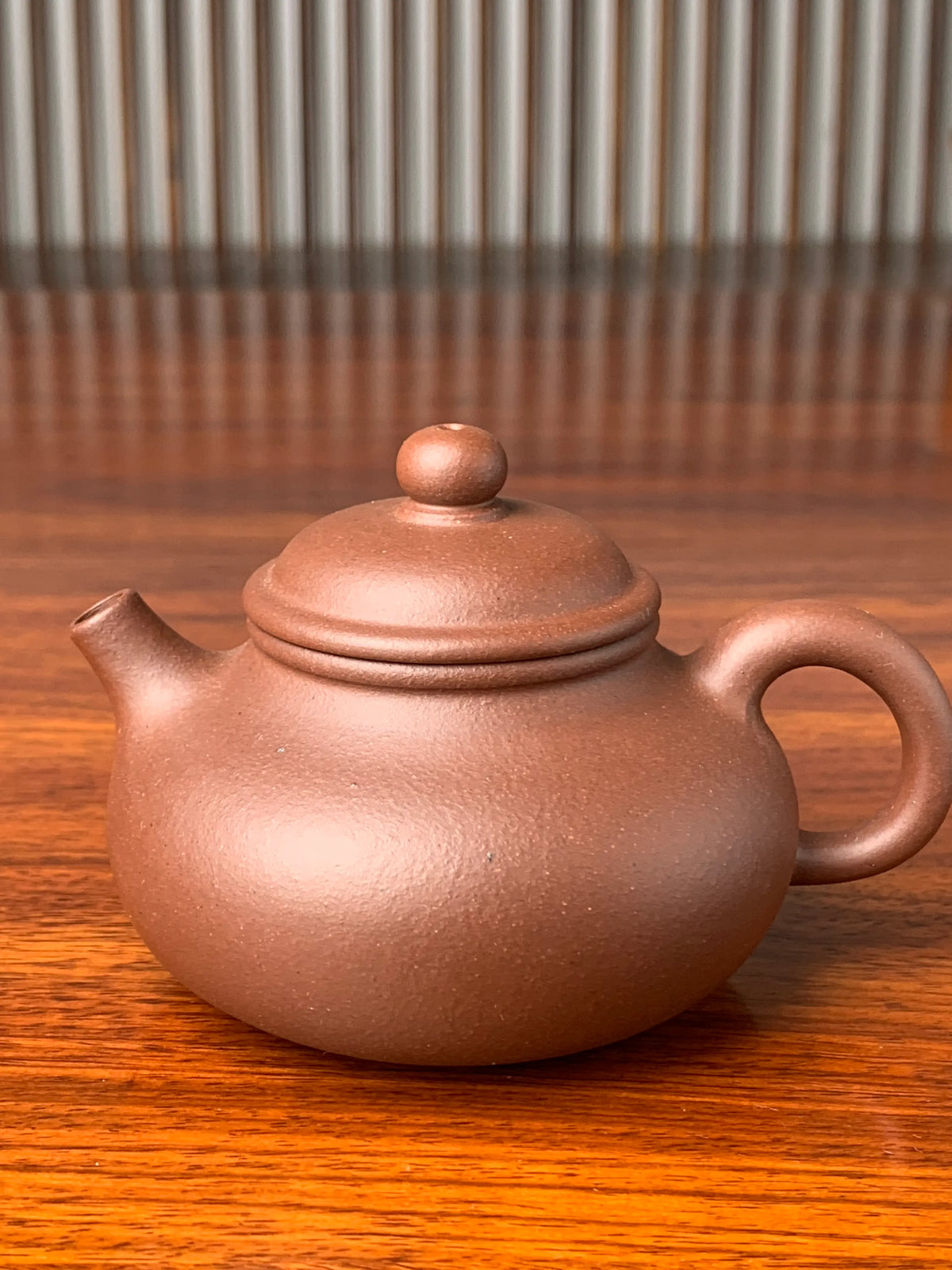 the front view of the yixing zisha clay teapot rong tian