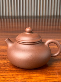 the front view of the yixing zisha clay teapot rong tian
