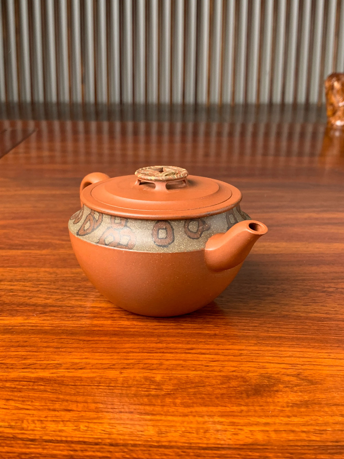the left view of the yixing zisha clay teapot named bring wealth