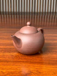 the right view of the handmade yixing zisha clay teapot qian gai shui ping