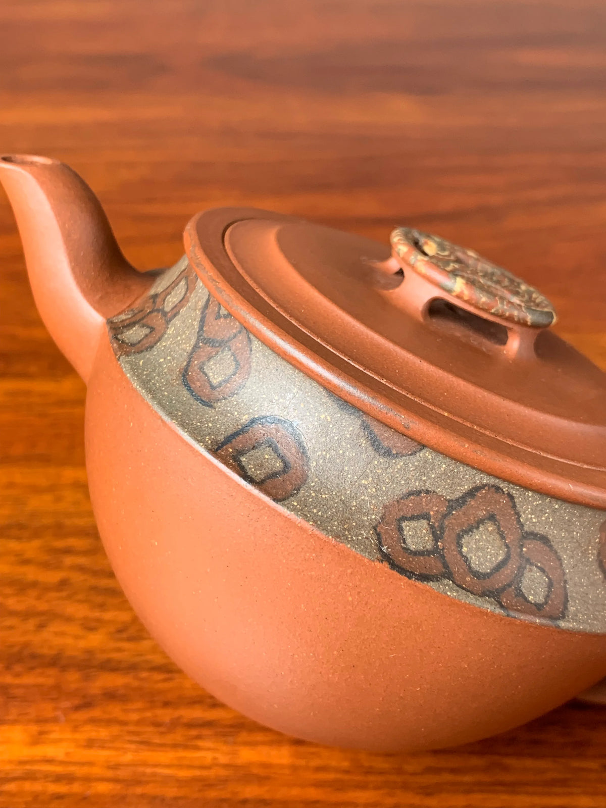 A close-up look at the details of the teapot body