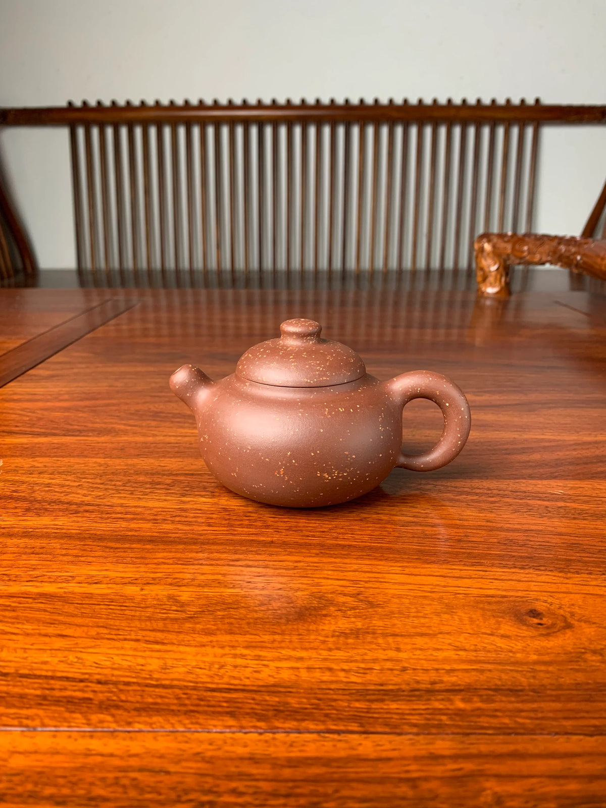 the yixing zisha clay teapot named you de on the table