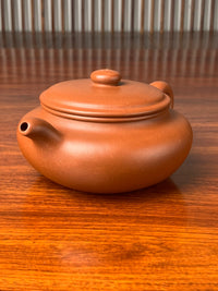 the right view of the yixing zisha teapot named bian fu