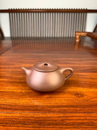 yixing zisha teapot shi piao on the table