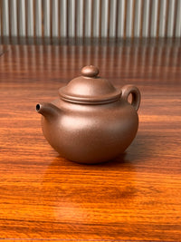 the left view of the yixing zisha teapot lian zi 