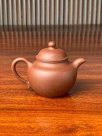the back view of the yixing zisha clay teapot gao lian zi