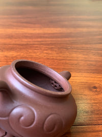 This is an authentic yixing teapot artwork fully handmade from yixing zisha purple sand clay,high-quality teapot