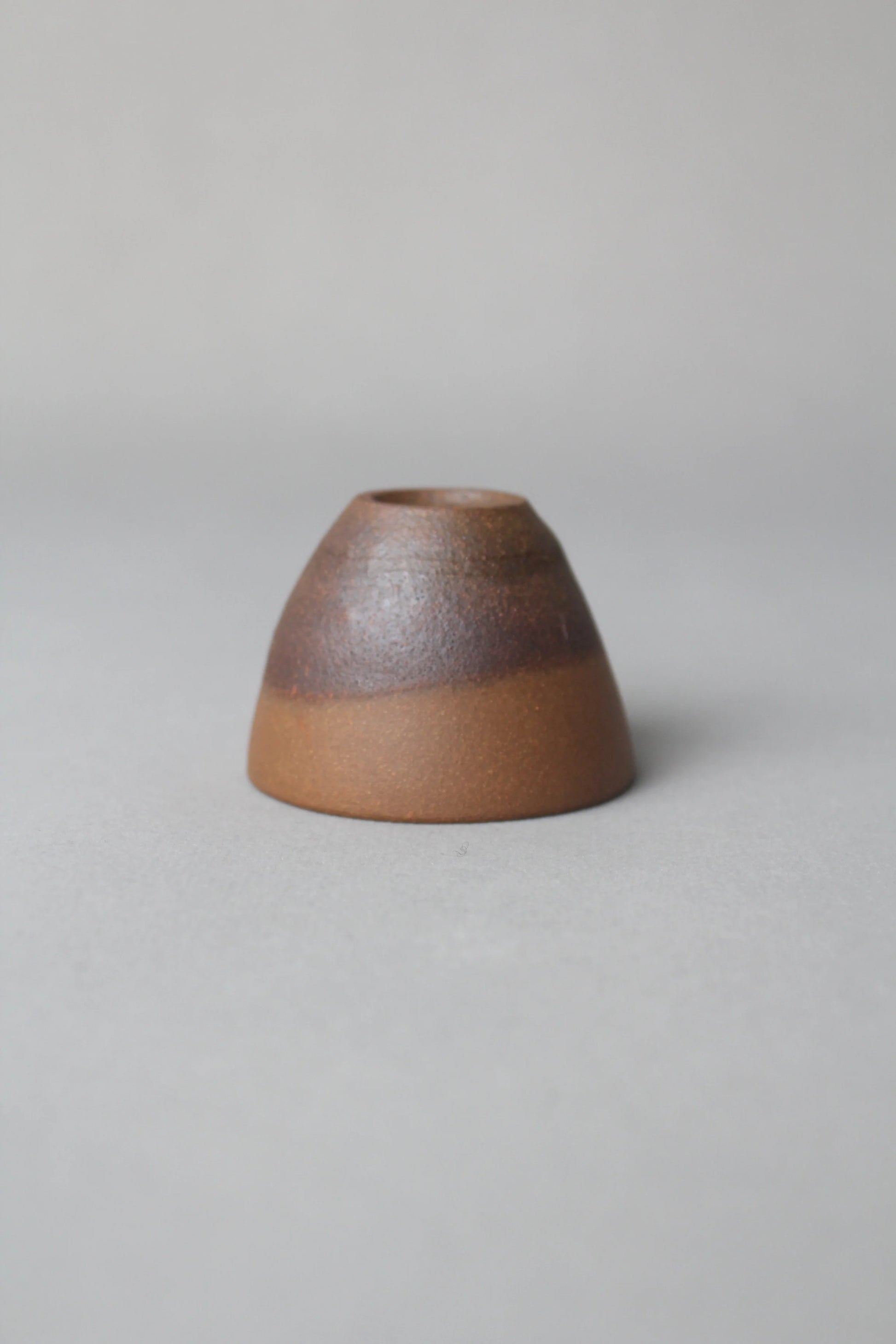 a beautiful zisha teacup is on the table front view