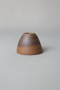 a beautiful zisha teacup is on the table front view