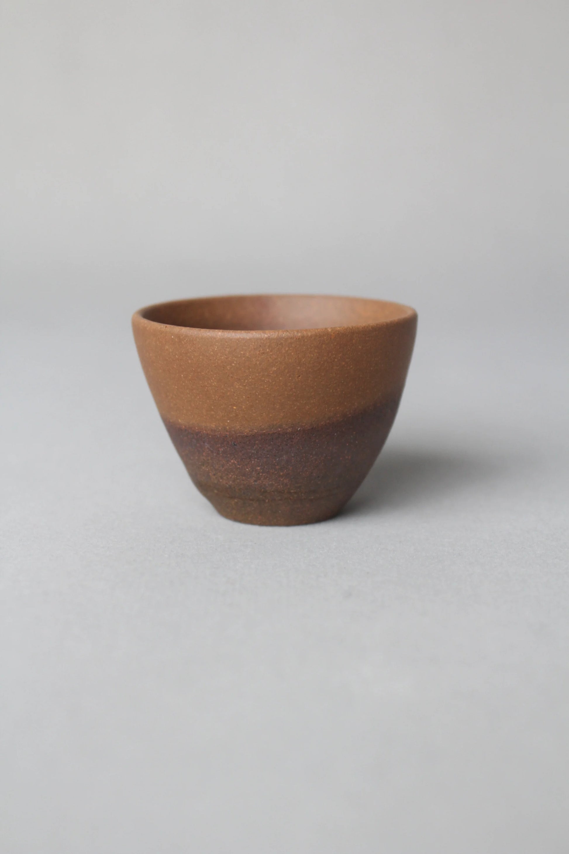 a zisha teacup is on the table side view