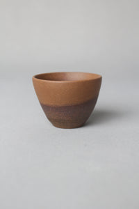 a zisha teacup is on the table side view