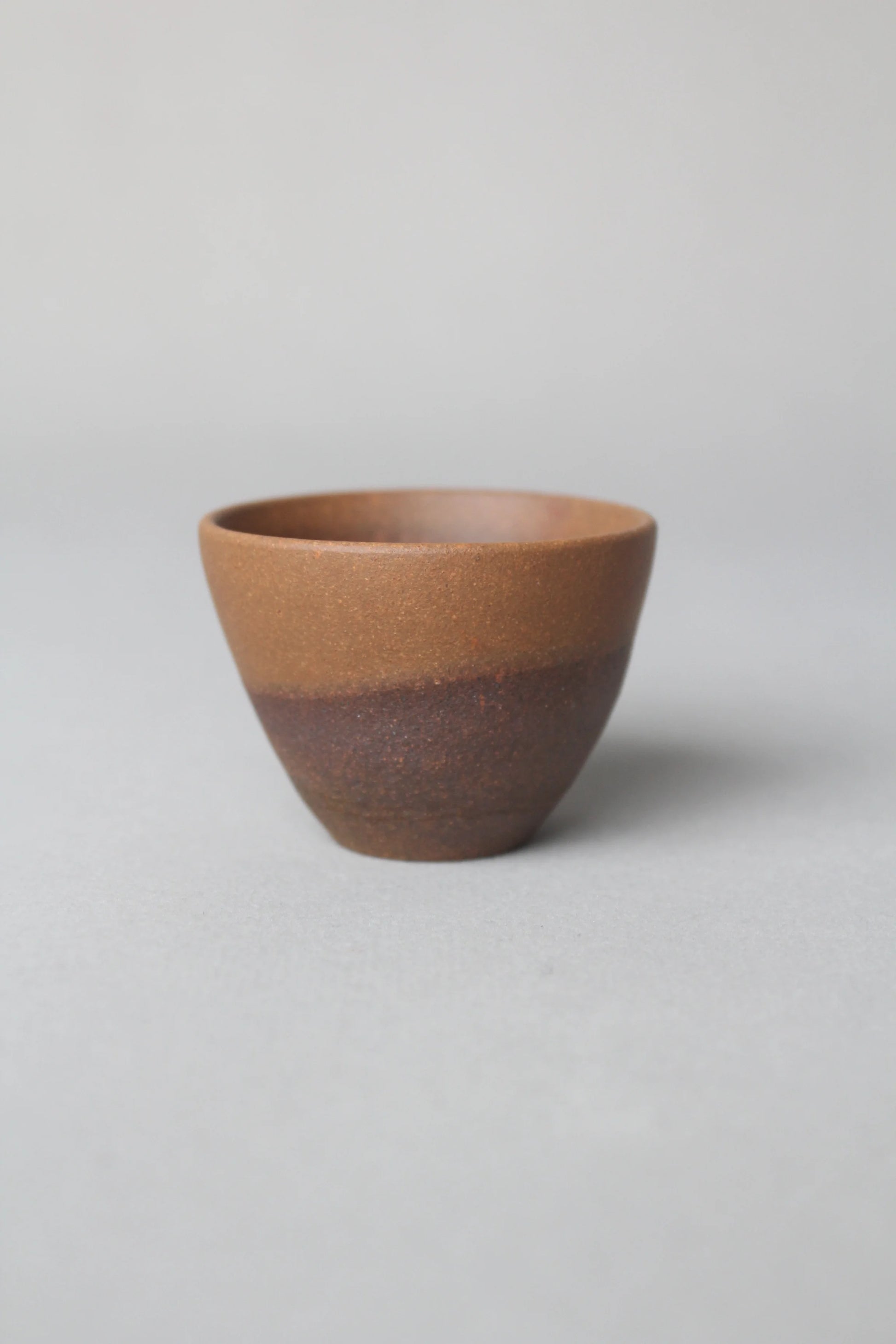 a zisha teacup is on the table front view