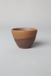 a zisha teacup is on the table front view