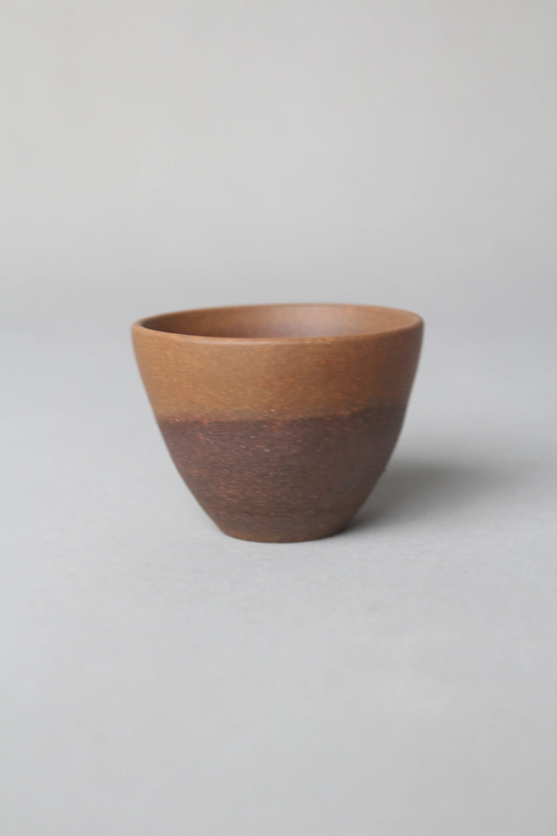 a zisha teacup is on the table left view