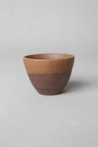 a zisha teacup is on the table left view