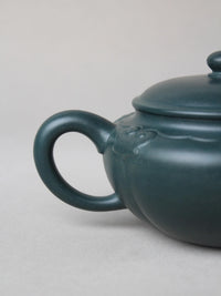 the handle of the collectible zisha teapot
