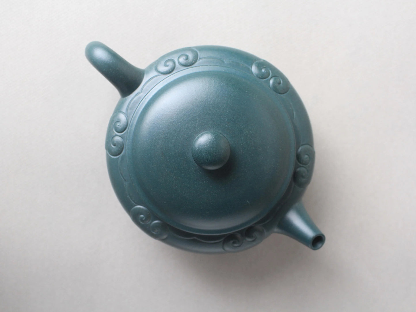 the front view of the collectible zisha teapot on the table