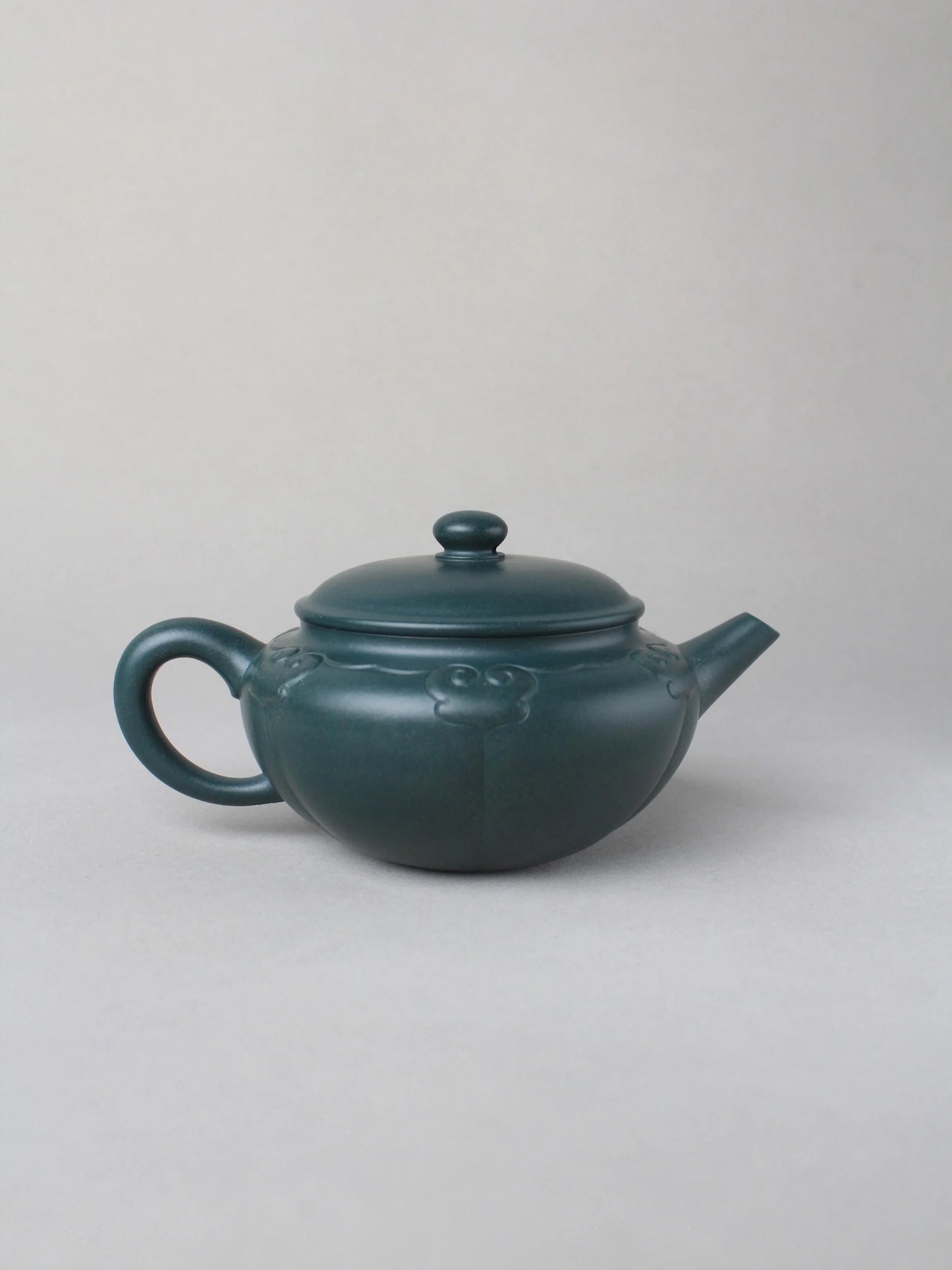 collectible zisha teapot on the table back view