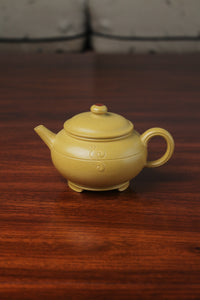 the zisha teapot on the table, handmade with purple clay from teapot art zisha art gallery 