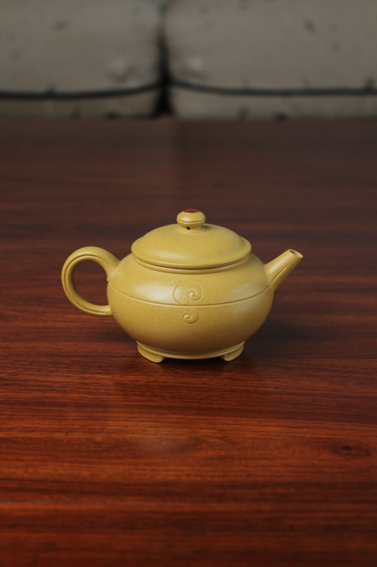 the back of zisha teapot on the table, handmade with purple clay from teapot art zisha art gallery 