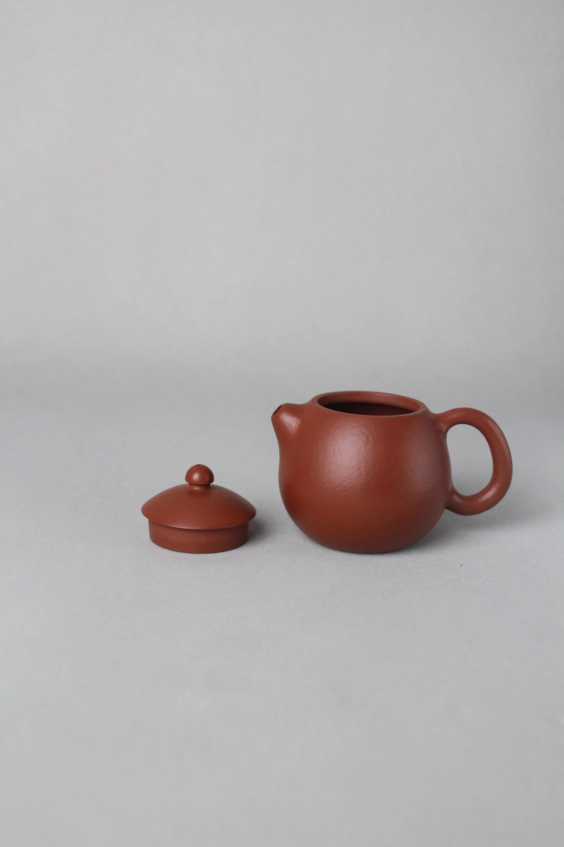 small dragon egg yixing zisha teapot on the table
