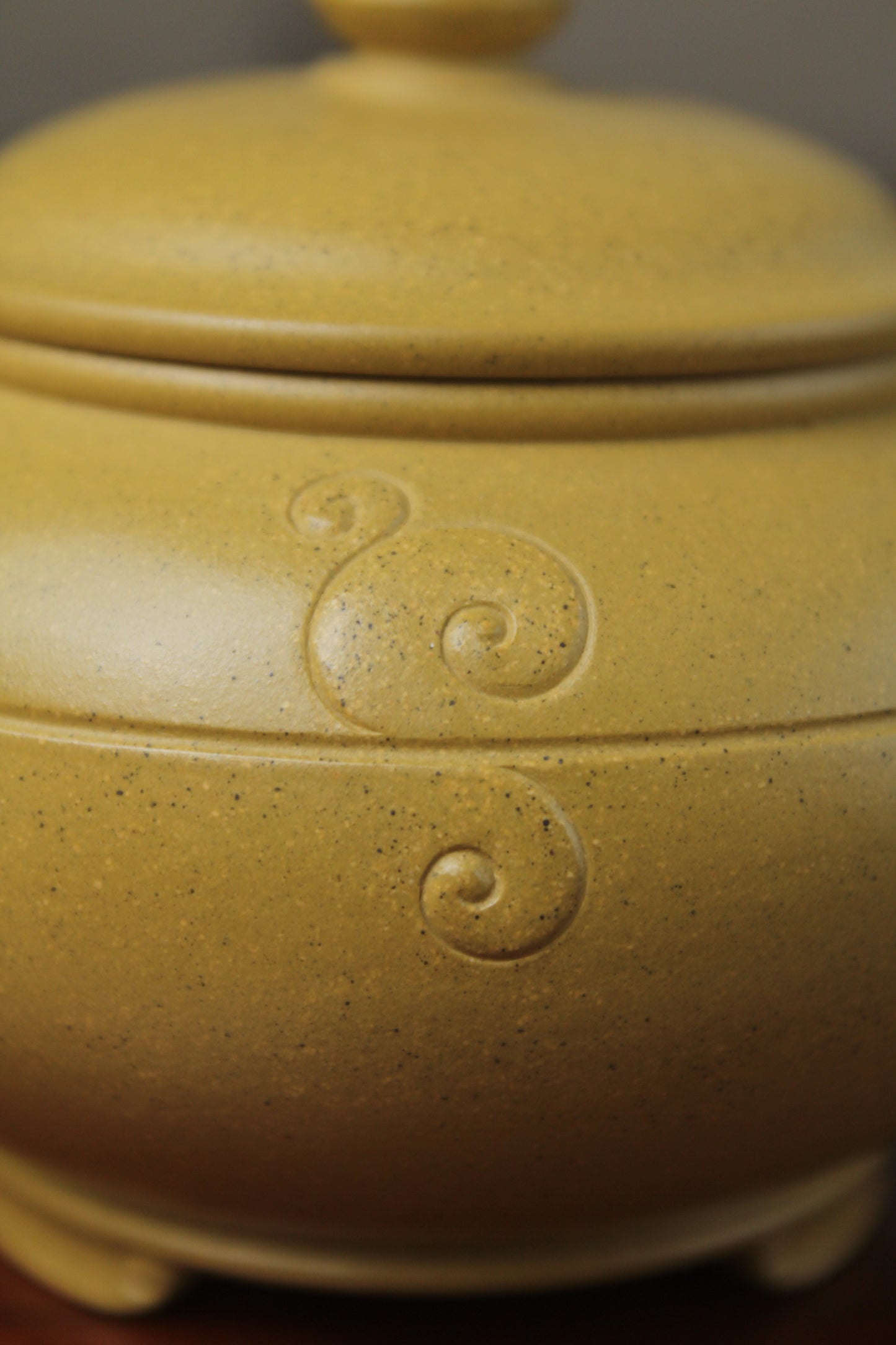 the detail of zisha teapot on the table, handmade with purple clay from teapot art zisha art gallery 