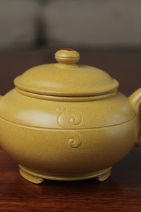 the details of zisha teapot on the table, handmade with purple clay from teapot art zisha art gallery 