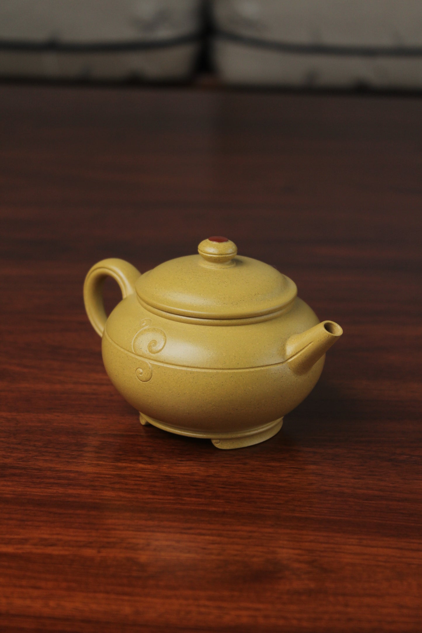 the left detail of zisha teapot, handmade with purple clay from teapot art zisha art gallery 