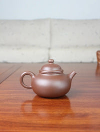 back view of zisha teapot rong tian