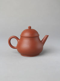 zisha teapot named pan hu on the table - back view