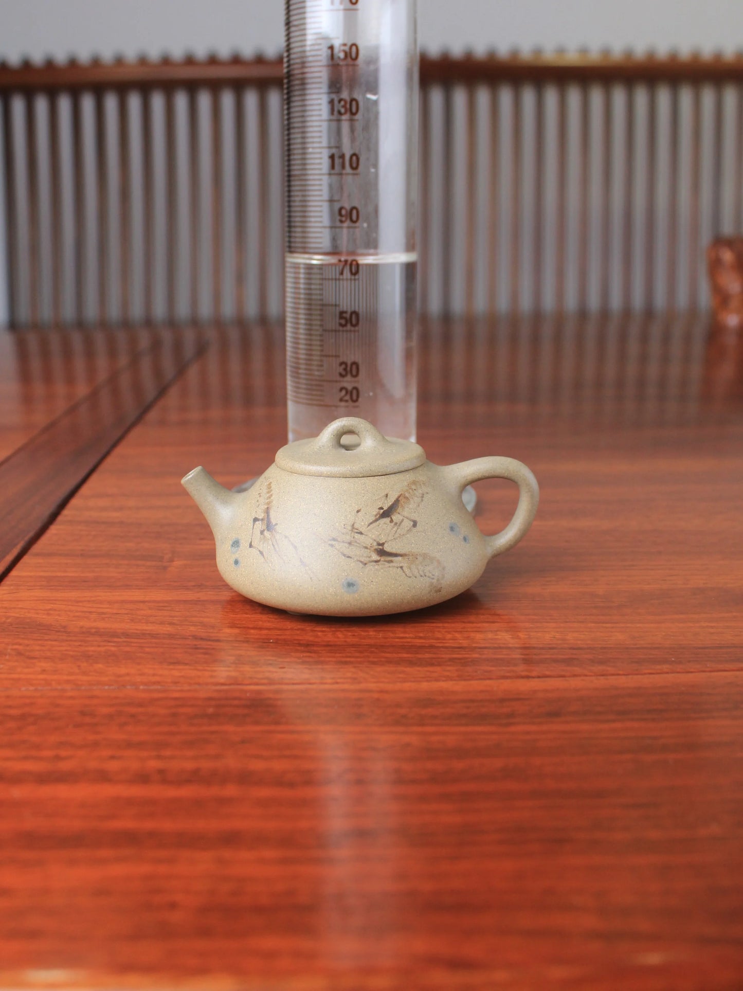 small size yixing zisha teapot on the table