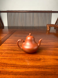 the back view of the zisha teapot named si ting