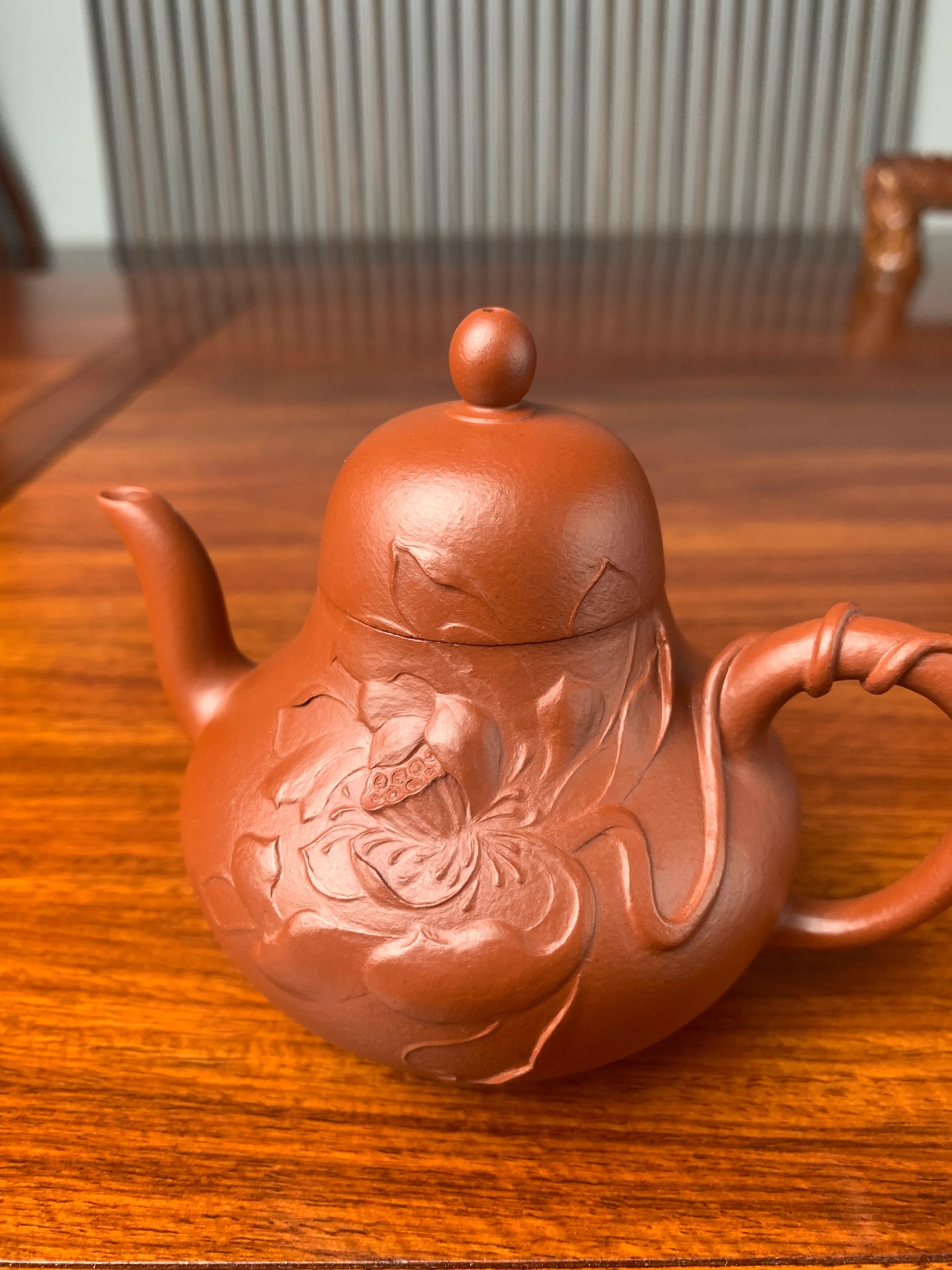 Close-up right view of the lotus sculpture on the teapot body
