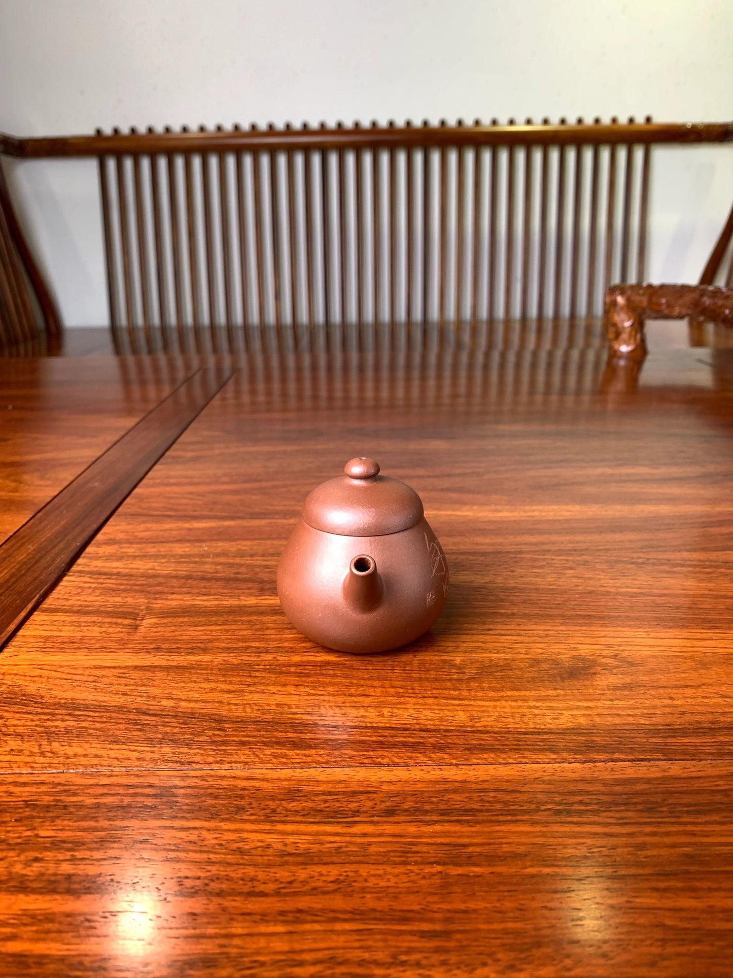 the front view of the zisha teapot named wen dan