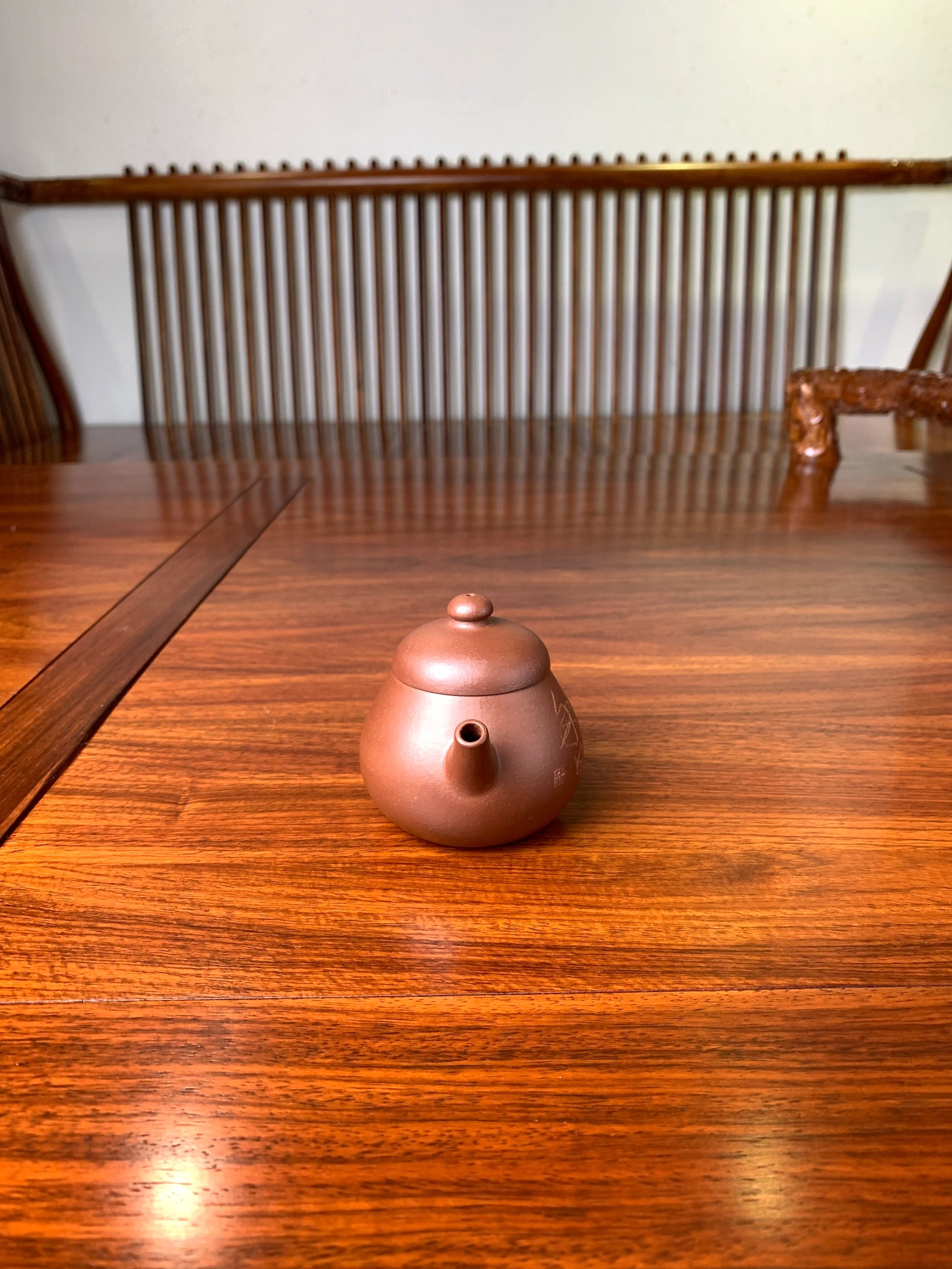 the front view of the zisha teapot named wen dan