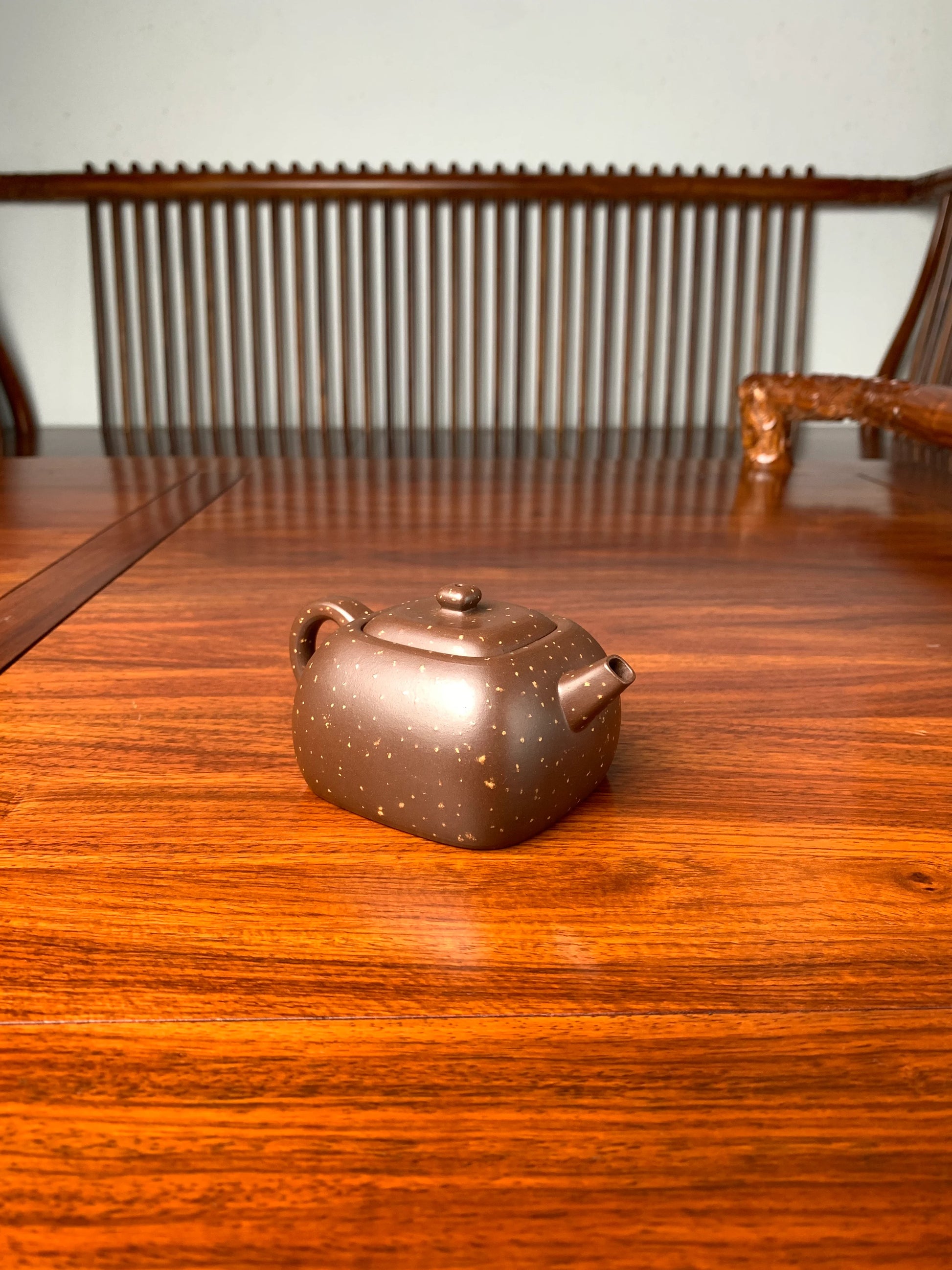 the left view of the zisha teapot on the table