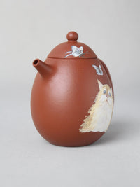 right view of the dragon egg zisha teapot with cat painting