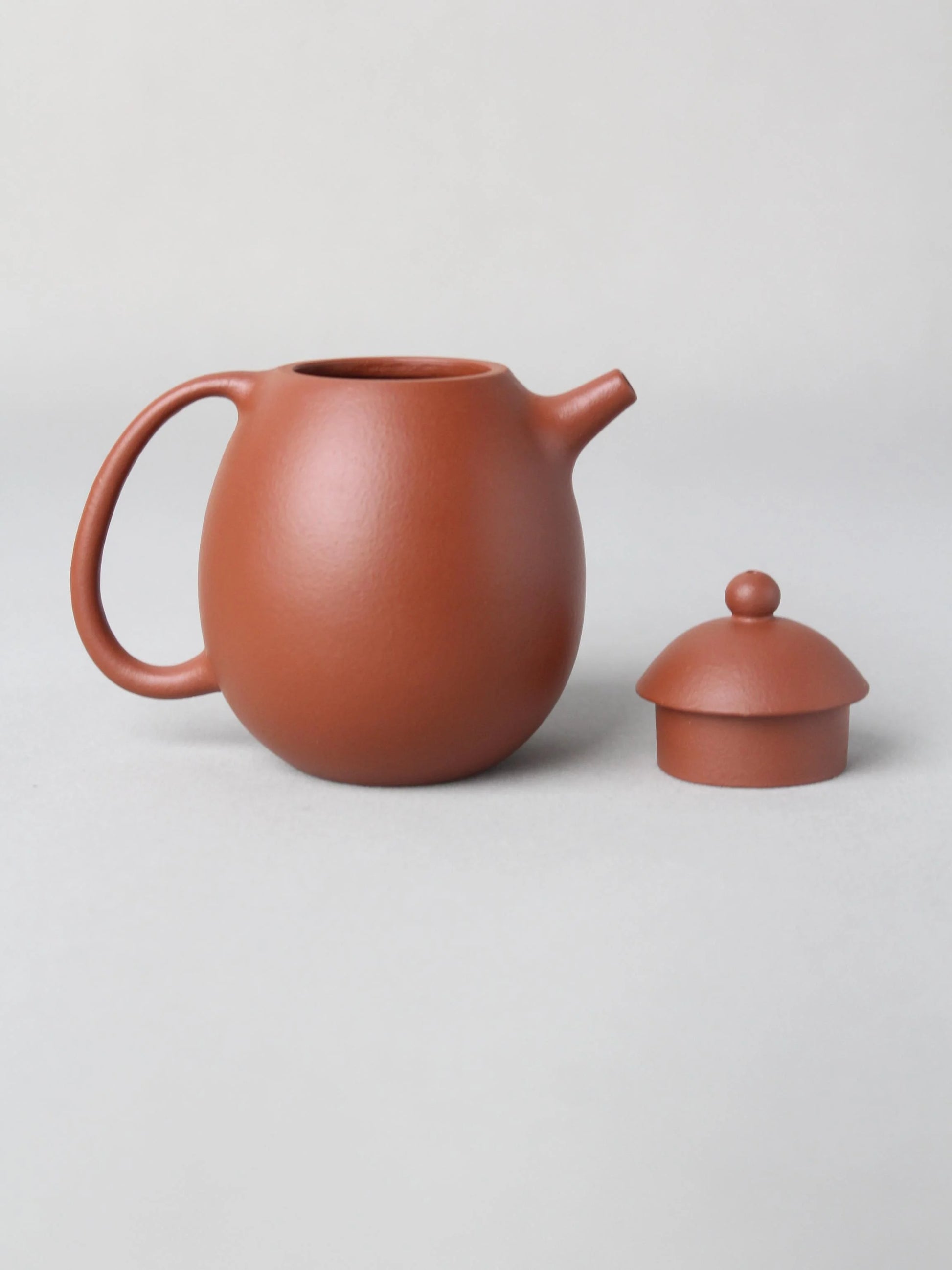 the details of the dragon egg zisha teapot with cat painting